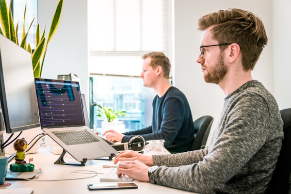 Software development team working together on project completion